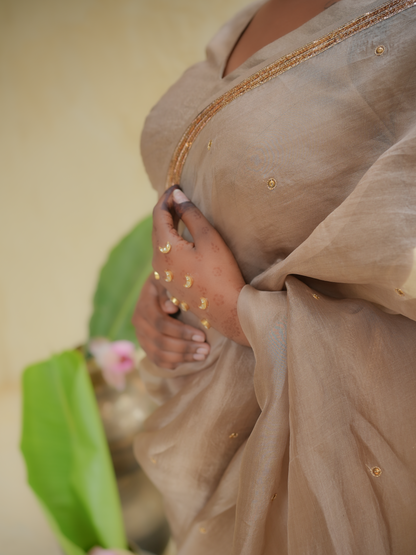 Champagne Gold Organza Saree with Zari Border & Sequin Buttas