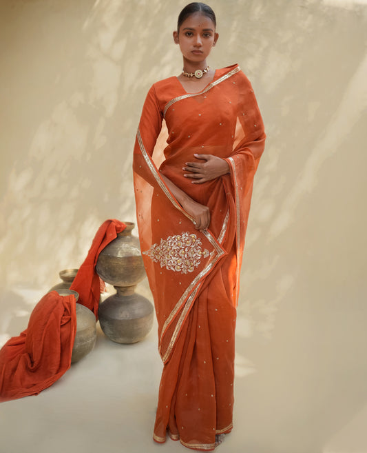 Rust Orange Organza Saree with Gold Zari Border & Embroidered Pallu